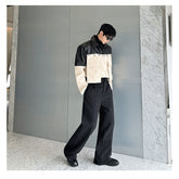 Autumn bomber jacket with a large pocket and contrasting color patchwork